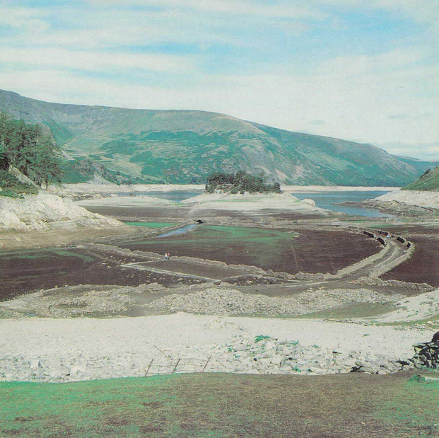 Haweswater reservoir, 17th September 1984. The substantial drawdown in the water level has revealed parts of the normally submerged village of Mardale which can be seen in the foreground. © J. Pechkam