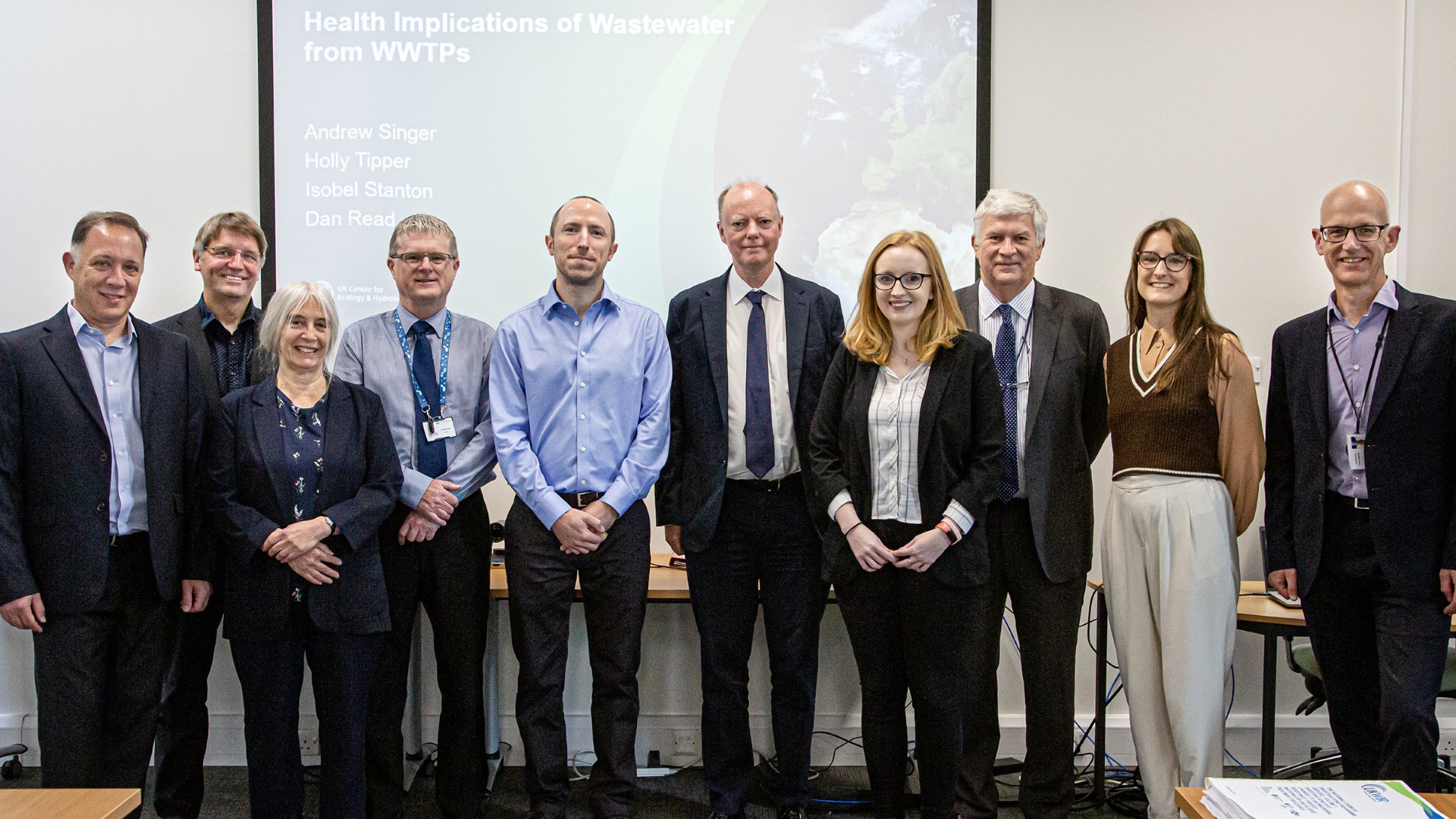 Nine UKCEH staff members with Professor Sir Chris Whitty