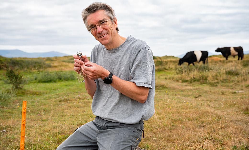 Laurence Jones of UKCEH surveying at Newborough Dunes near Bangor