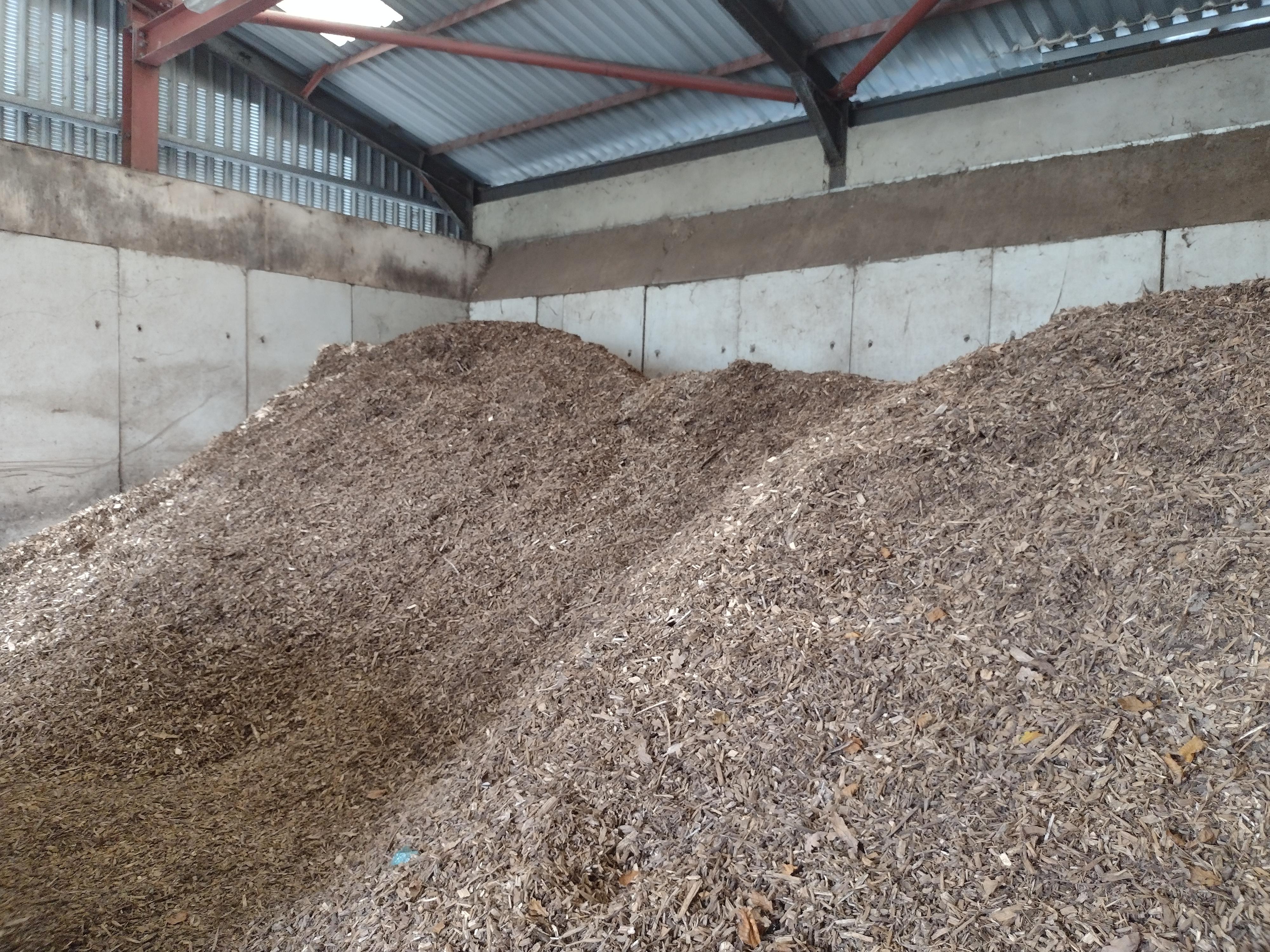 2 large piles of wood chips