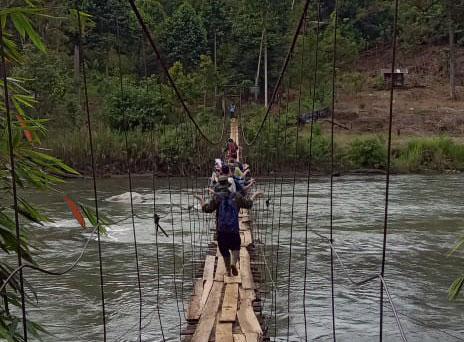 Credit LF Banin Caption "Crossing the river at Air Tenam village to coffee and durian small-holdings and forest areas"