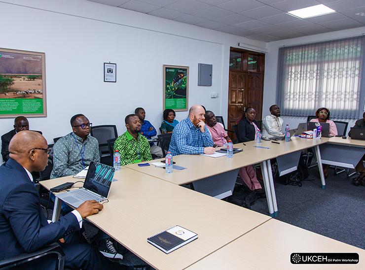 People seated behind desks taking part in a workshop