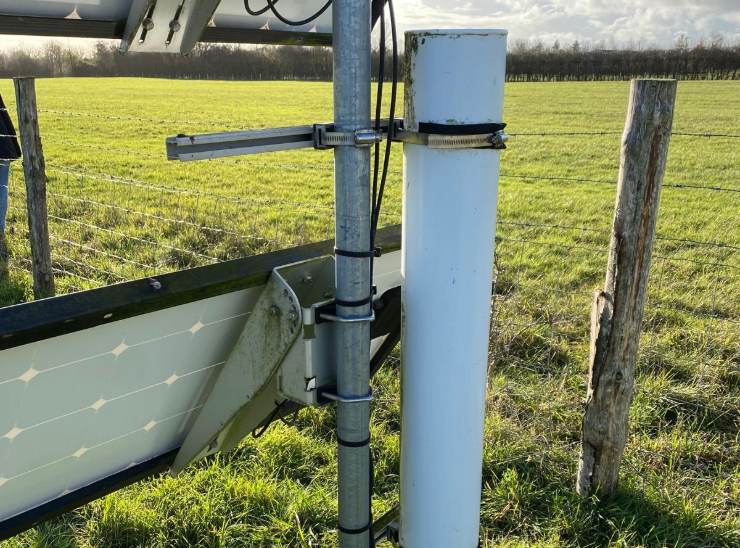 White tube attached to solar panels