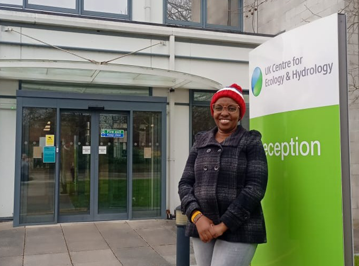 Jemimah Gacheru outside the entrance to UKCEH Wallingford