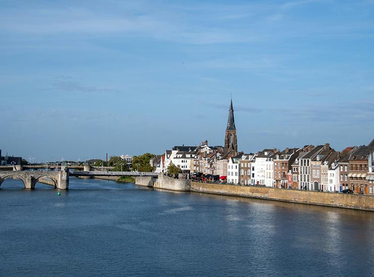 Buildings alongside river in Maastricht