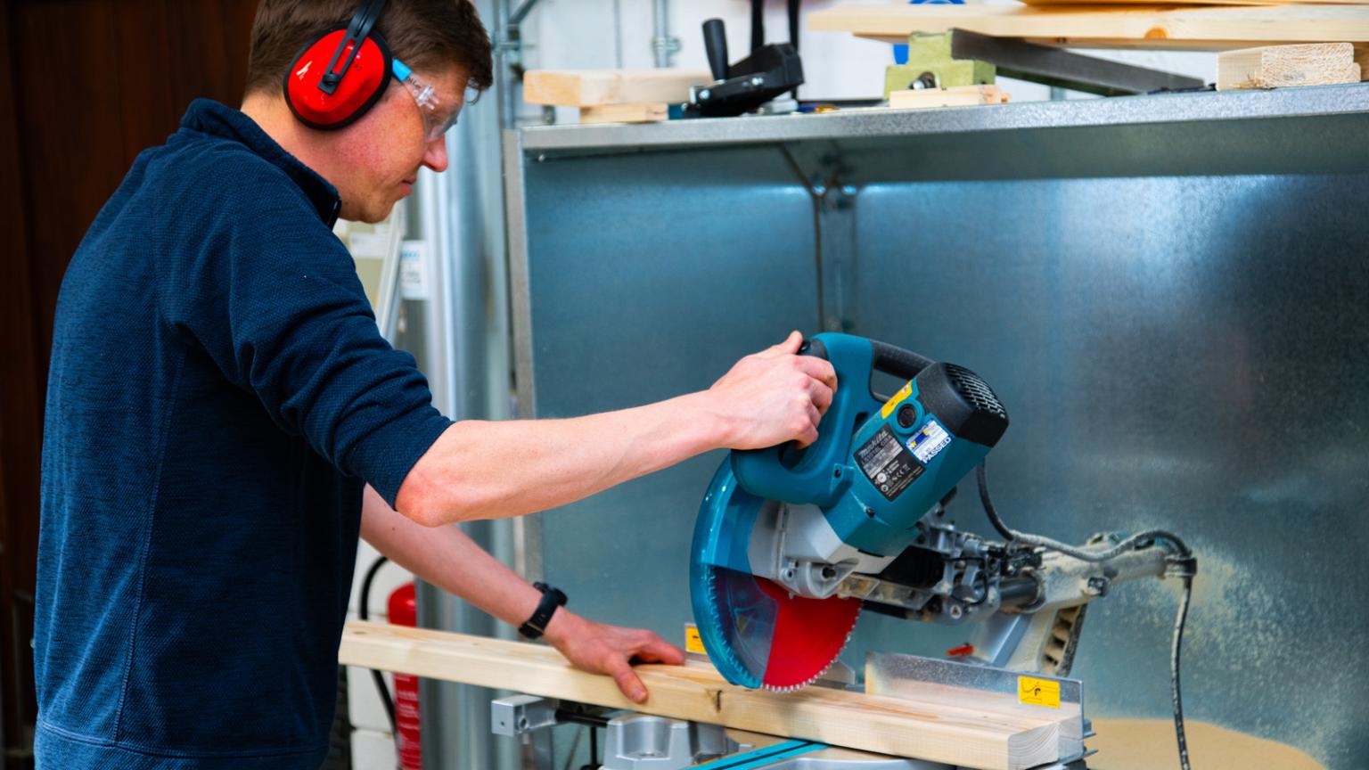 Man using a saw