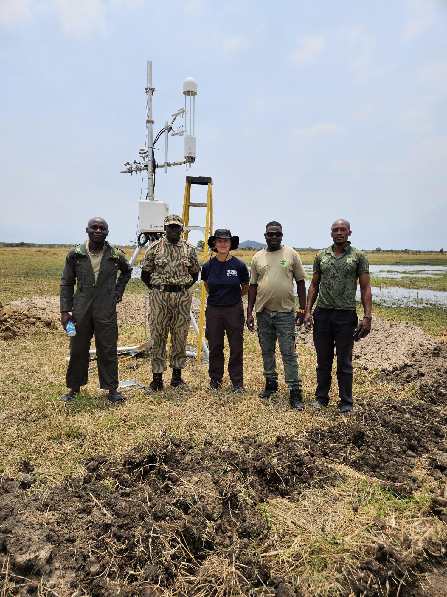 Group of people stood in front of a tower
