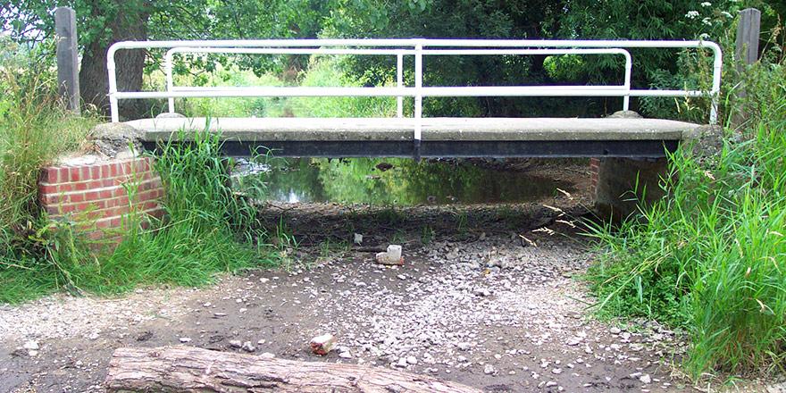 Dry river under a bridge