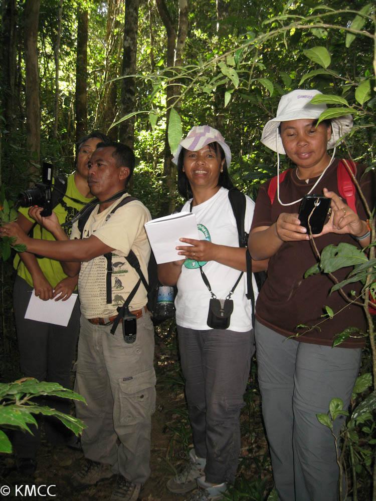 Group of people standing in a forest