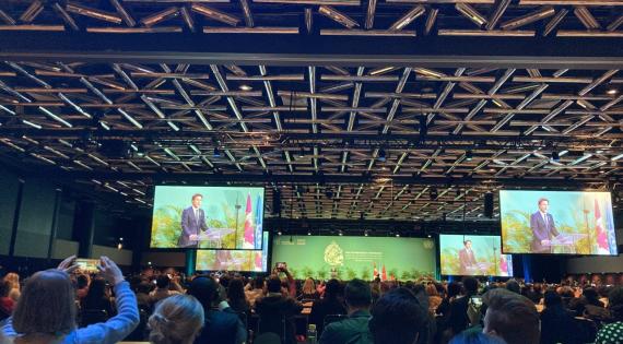Inside COP15 plenary with Justin Trudeau visible on big screens