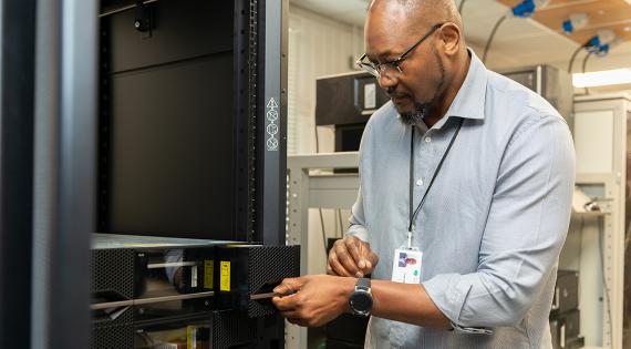 Franck Mpinda in the server room at UKCEH Wallingford