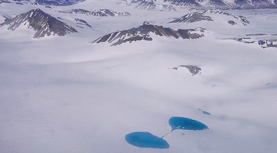 View of mountains, glaciers and lakes from the plane window