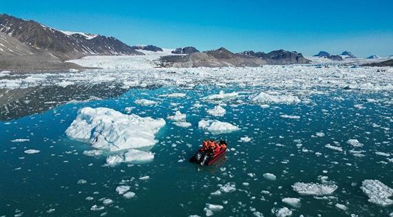 Drone view of small boat in Arctic waters