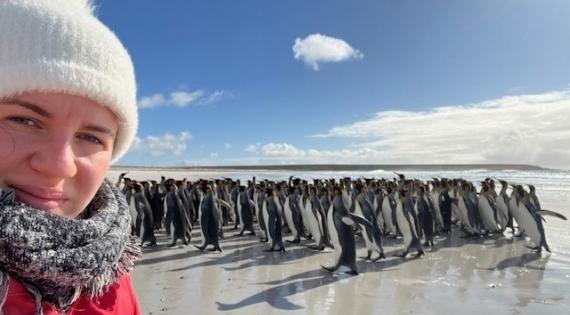 Emily Williams with penguins on the Falklands.