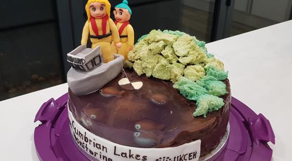 A cake with iced people and a boat celebrate Cumbrian lakes monitoring