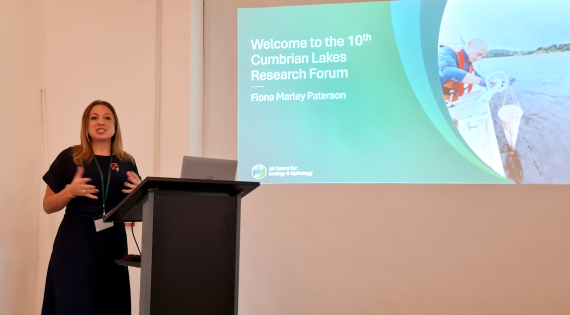 Fiona Marley Patterson stands at the lectern to open the 10th Cumbrian Lakes Research Forum