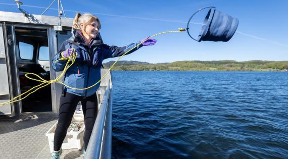 Helen Skelton collecting a water sample from Windermere for UKCEH lake science