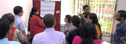 People standing at a flipchart