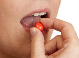 Taking a pill - image by Shutterstock