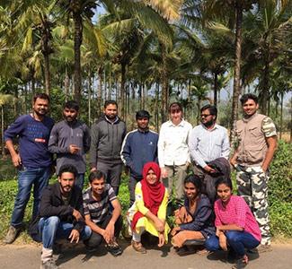 Group of people in front of trees