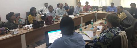 UK and Indian scientists seated around a table