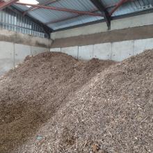 2 large piles of wood chips