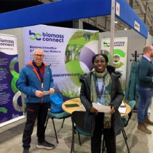 two people next to ag show stand