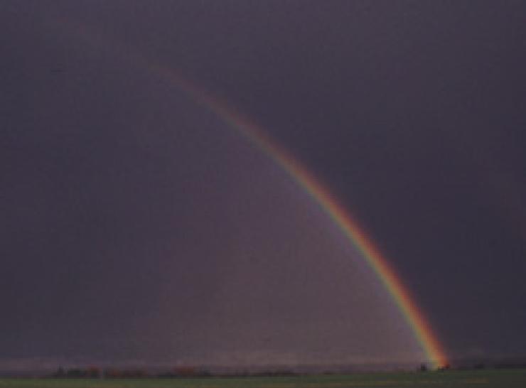 Rainbow against a dark sky