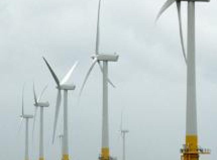 Row of 5 wind turbines in the sea