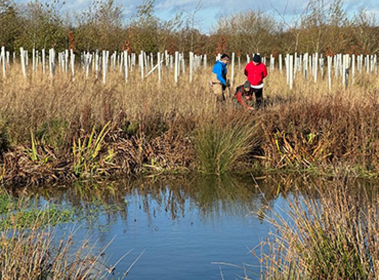 The Spongescapes team beside the pond. Image by Boffin Media