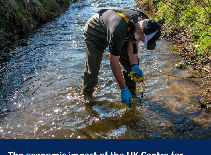 Report cover entitled The economic impact of the UK Centre for Ecology & Hydrology featuring an image of a hydrologist stands in stream with device